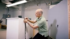 CR technician anchoring a dresser.