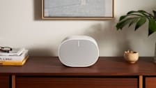 Sonos Era 300 speaker sitting on a credenza in a living room
