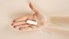 tampon in palm of hand