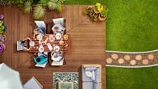 Overhead view of deck with people at a table eating outdoors