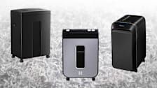 Three paper shredders on a shredded paper background