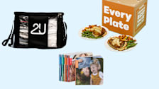 Laundry bag, meal kit with plates, and photo books on a blue background