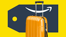 Luggage with a large sales tag and an Amazon smile logo