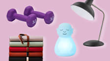Dumbbells, journals, meditation buddha, and lamp