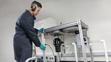 An engineer testing garbage disposals in lab