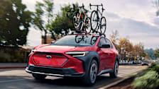 2024 Subaru Solterra driving with bikes