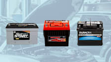Super Start Platinum AGM 65PLT Car Battery, Odyssey Extreme Series 35-PC1400T Car Battery, and Duracell Platinum AGM 47 (H5) Car Battery on background of car shop with open hood on car