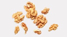 Shelled whole walnuts and pieces of walnuts