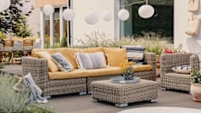 outdoor seating area on a deck in a backyard