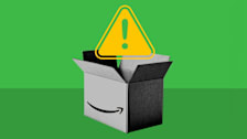 photo illustration of open Amazon cardboard box with yellow caution symbol above it
