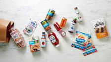 paper grocery bag with various low and no sugar grocery items coming out of it