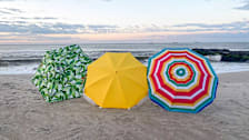 Tommy Bahama, Captiva, and Mainstays beach umbrellas on a beach