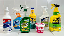Seven grout cleaners on a white tiled surface