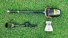 Arm & Hammer, Dog Buddy, and Pooch Approved poop scoopers on grass