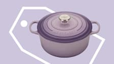 Le Creuset Traditional Round Cookware with shopping tag on purple background.
