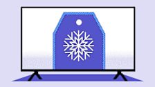 A TV displaying a purple price tag with a white snowflake design in the center and a blue-trimmed border, set against a light purple background