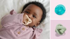 A baby with a Dr. Brown’s Happy Paci Silicone Pacifier in her mouth, next to a Philips Avent Soothie Baby Pacifier and Itzy Ritzy Silicone Pacifiers.