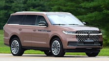 A view of the front of the 2025 Lincoln Navigator being driven.