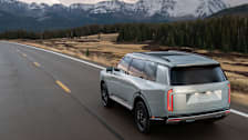 2026 Kia Telluride Hybrid SXP driving toward snow-capped mountains