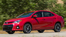 2014 Toyota Corolla driving on a road.