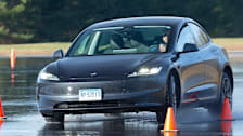 Tesla Model 3 going through the wet handling course