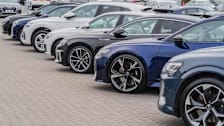 a row of parked cars at an auto dealership