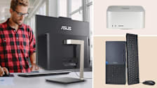 Person using the Asus Zen AiO at a standing desk, the Apple Mac Studio, and the Dell Tower Plus.