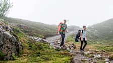Two people hiking in the fog