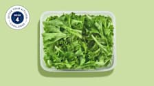 salad greens in a plastic container