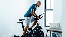 A man using the Horizon 7.0 IC exercise bike in a home environment.