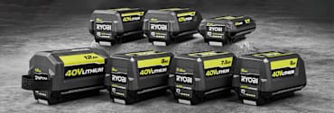 seven Ryobi 40v Lithium batteries of various types (2, 4, 5, 6, 7.5, 8, and 12Ah) on concrete surface
