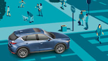 Car coming to a stop as a pedestrian enters a crosswalk.