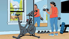 a woman lifting weights in a home gym