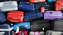 An assortment of suitcases stacked.