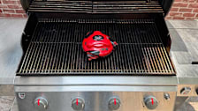Grillbot Automatic Grill Cleaning Robot on a grill.