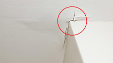 Cracks due to water damage in ceiling of home