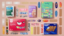 grid of Curad, Ouch Essentials, Up&Up, Band-Aid, and Welly bandage boxes and bandages