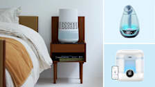 Clockwise from left: Blueair Invisible Mist humidifier on a table by a bed, Babymoov Hygro (+), and the Dreo HM524S humidifier