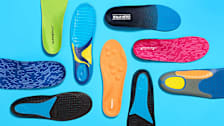 overhead view of 9 different shoe inserts on light blue background