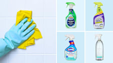 Hand wearing rubber glove cleaning shower tile, Scrubbing Bubbles, OxiClean, Clorox, Method shower cleaners