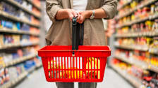 Person holding shopping basket