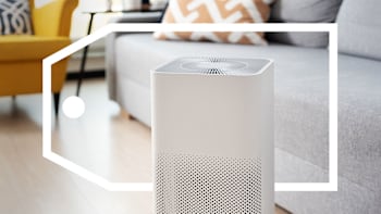 An air purifier in a living room surround by a deals tag graphic.