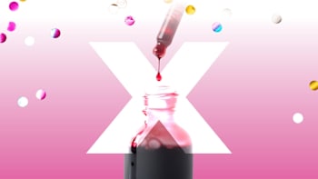 A large white "X" shape, a dropper releasing red liquid into a small bottle below, surrounded by colorful, reflective round confetti-like shapes on a pink background.
