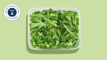 salad greens in a plastic container