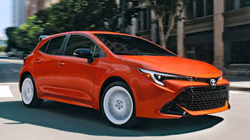 2026 Toyota Corolla Hatchback FX driving through a city.