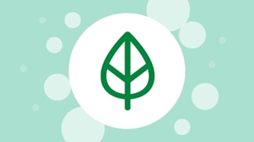 Green leaf in a white circle on a green bubbly background