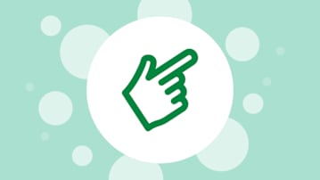 Pointing hand in a white circle on a green bubbly background