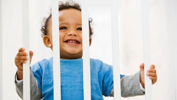 Baby behind safety gate