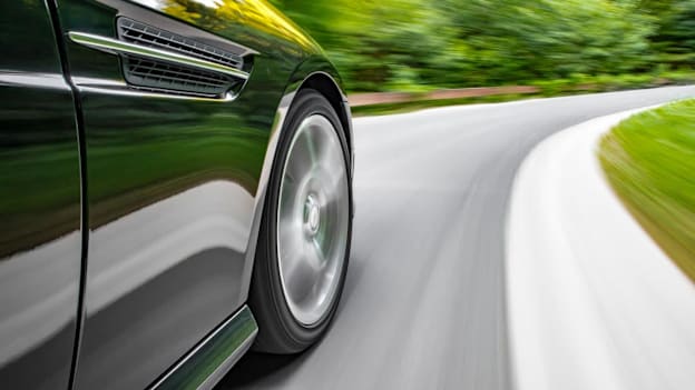 close up of a car driving on a road