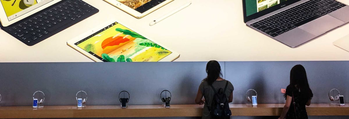 people shopping in electronics store